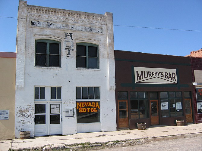 Photo of a few of the historic storefronts on Front Street in Wells. Much of the district was destroyed by an earthquake about a year after the photo was taken.