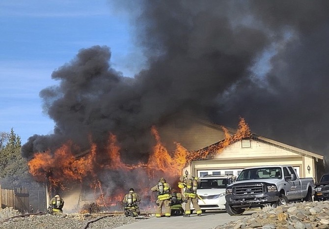 Flames engulf a Pine View Estates home on Friday afternoon.