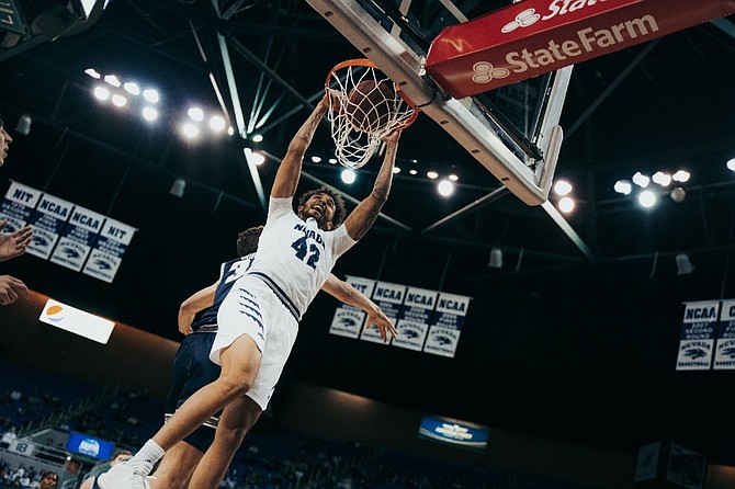 Nevada’s K.J. Hymes dunks against Utah State on Jan. 29, 2022 at Lawlor Events Center in Reno. (Photo: Nevada Athletics)