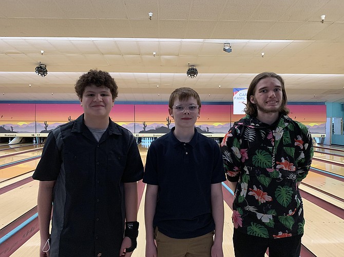 Division winners of the Northern Nevada Masters Tournament held Sunday at Carson Lanes are, from left, Shane Shook, B Division winner; Aiden Melanaphy, C Division winner; and Derrick Johnson, A Division winner and overall tournament champion.