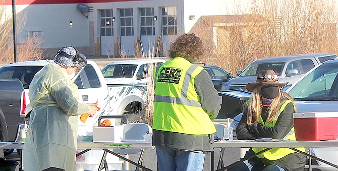 Members of the Community Emergency Response Team work a coronavirus event at the Douglas County Senior Center in May 2021.