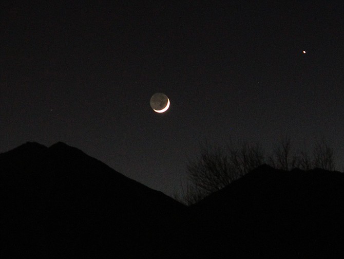 Gardnerville Ranchos resident Paul Sargis caught the toenail moon setting over Jobs Peak on Wednesday night.