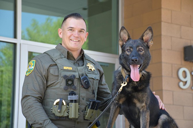 Deputy Derrick Kepler stands with Camper, one of the newest four-legged members of the K-9 Unit.