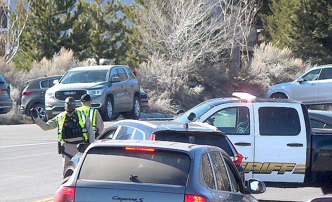 Douglas County deputies turn motorists around at the base of Kingsbury after it was closed by a collision on Monday afternoon.