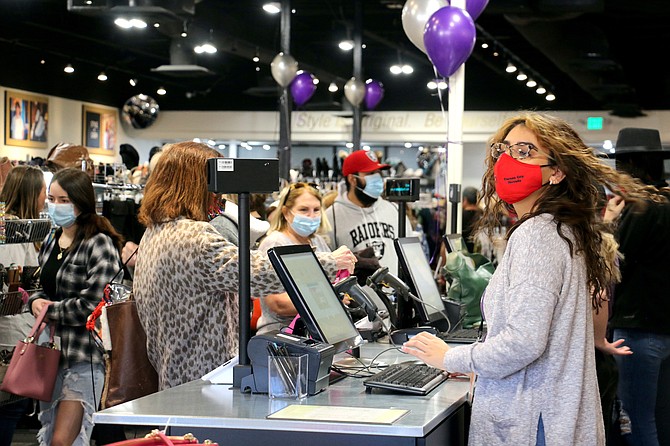 Plato’s Closet had a line of customers down the sidewalk Feb. 10, 2022 when it offered door-buster deals for its ribbon cutting. (Photo: Faith Evans/Nevada Appeal)