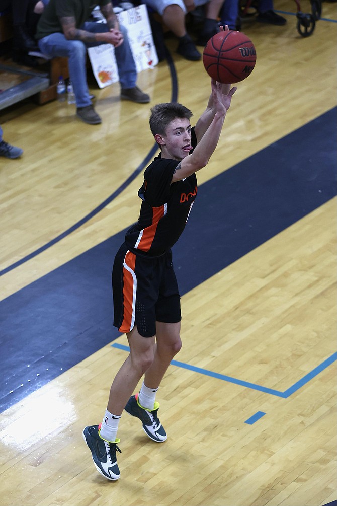 Douglas High's Kasen Boggs (1) hits one of his seven 3-pointers during which the Tigers tied a team single-game record for triples in a game with 20. Boggs finished with a game-high 31 points.