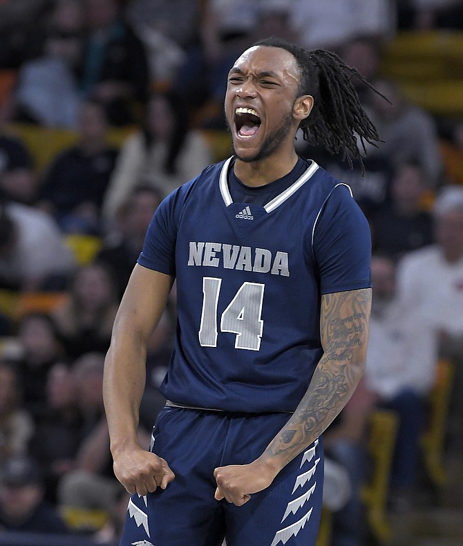 Nevada forward Tre Coleman celebrates after making a basket against Utah State on Feb. 11, 2022, in Logan, Utah. (Eli Lucero/The Herald Journal via AP)