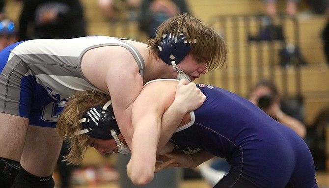 Jon Barnes-Hurt works for a takedown during the Class 5A regional wrestling tournament Saturday at Spanish Springs. Barnes-Hurt took third at 145 pounds, punching his ticket to the state tournament.