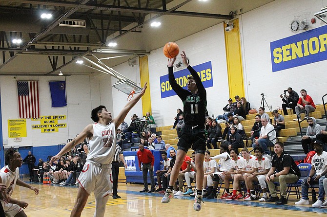 Fallon senior Tyler Austin launches a 3-pointer in Fallon’s 48-40 loss to Wooster on Thursday.