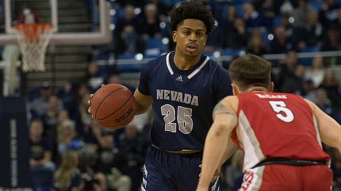 Nevada’s Grant Sherfield is guarded by UNLV’s Jordan McCabe on Feb. 22, 2022 at Lawlor Events Center in Reno. (Photo: Nevada Athletics)