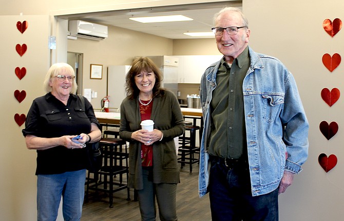 Carson Valley residents Lynne and Ron Savinski flank new Carson Valley Community Food Closet Manager Desiree Witteman during a Feb. 10 open house.