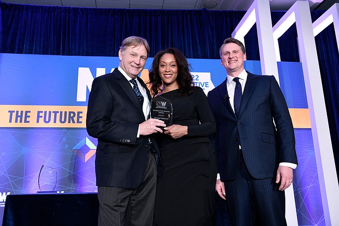 Kimball Midwest Chief Executive Officer Pat McCurdy Jr. receives a Distributors Deliver Award from the National Association of Wholesaler-Distributors, represented by Director of Thought Leadership Alexandria Crenshaw and CEO Eric Hoplin, during the NAW 2022 Executive Summit in Washington, D.C.