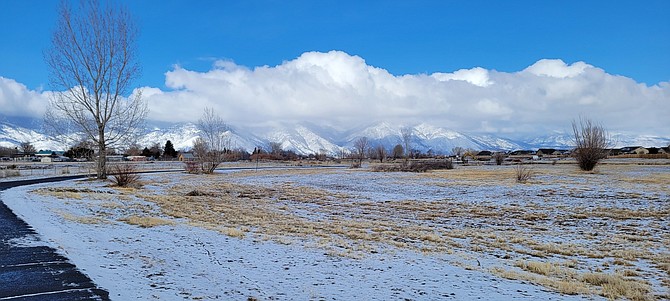 Deborah Blackman took this photo of the Carson Range from the Martin Slough Trail on Thursday morning. In the background, construction equipment is working on extending the trail toward Minden.