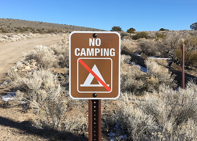 A no camping sign at the entrance to public lands at the top of Stephanie Way on Thursday.