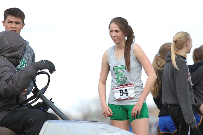 Ex-Greenwave jumper Brynlee Shults talks with coach Paul Orong after one of her jumps.