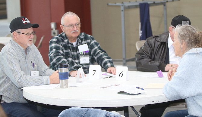 Tom Riggins, left, and Gary Smith, chairman of the Churchill County Republican Central Committee, listen to a question at Saturday’s Churchill County Republican Central Committee’s precinct meeting.