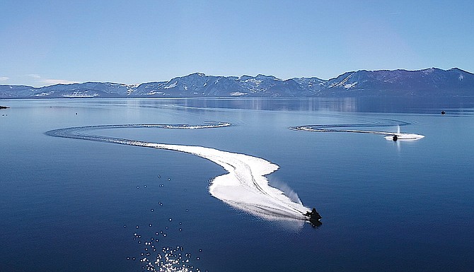 Jet skis ride on Lake Tahoe near Cave Rock on Feb. 12 in this photo by Bob Buehler