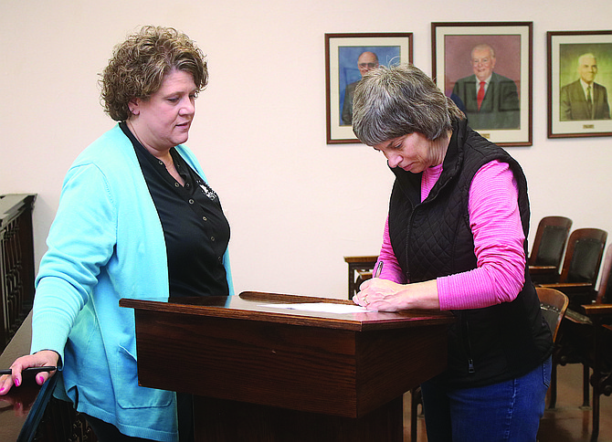 Kelly Frost, right, who represents Ward 1, files for re-election Monday as Fallon Deputy Clerk Elsie Lee watches the councilwoman complete the paperwork.
