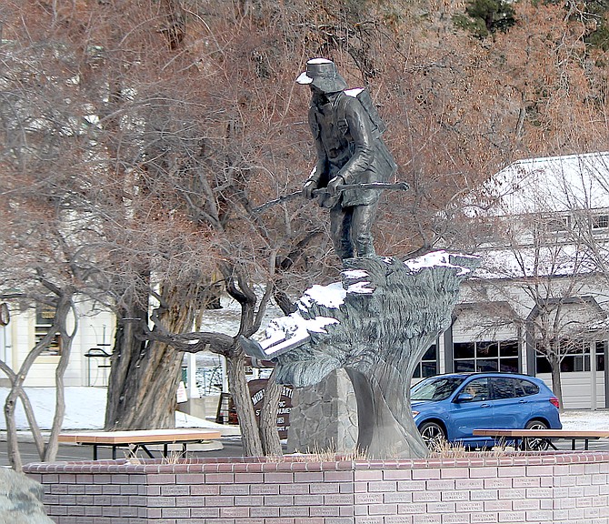 A dusting of snow adorns the statue of Snowshoe Thompson on Thursday morning.