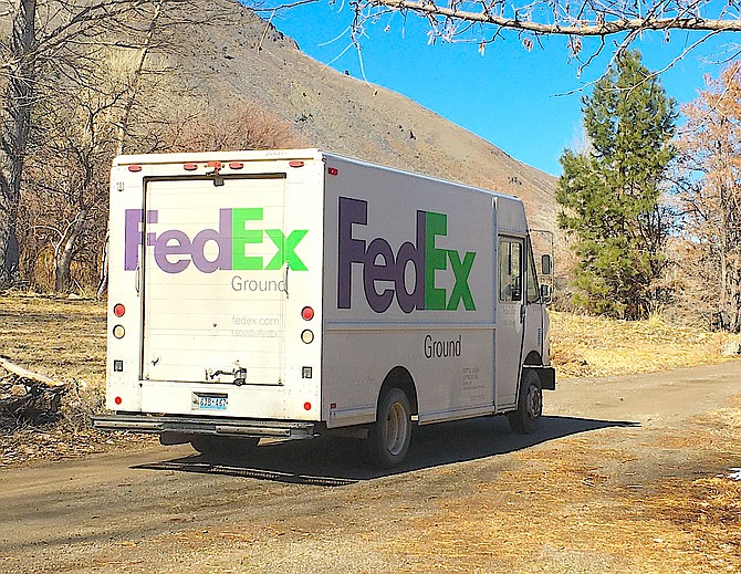 A FedEx truck delivers an online order in Genoa.