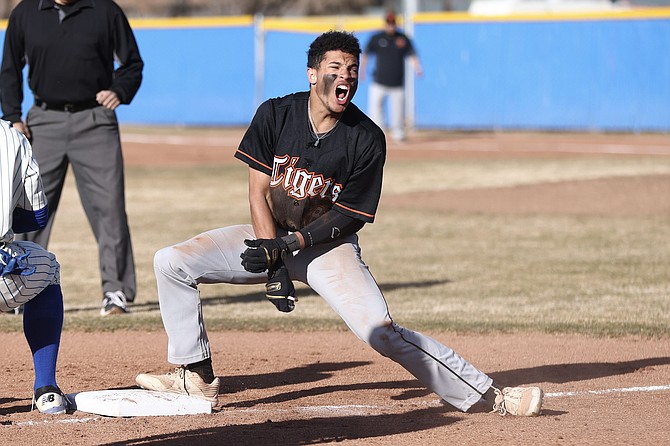 Thomas Young celebrates after hitting a leadoff triple against Carson High on Tuesday. Young, a sophomore, will likely be penciled into the leadoff spot for a majority of the Tigers’ games this season.