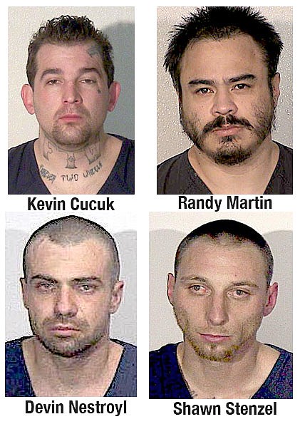 Four Douglas County Jail inmates are being held on $25,000 bail each in connection with a March 14 attack on another prisoner.