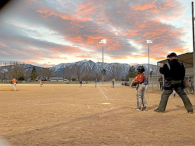 Genoa resident Walker Tholen is behind the plate catching at the AA Giants vs. Cubs game on March 21 as umpire John Lynch officiates. Special to The R-C