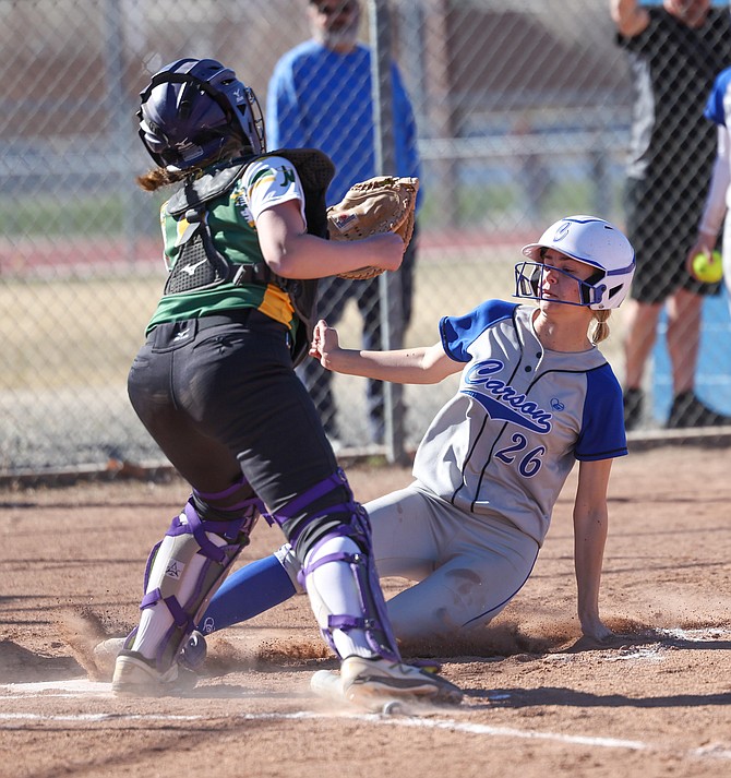 Carson High senior Shannen von Duering slides into home plate during the Senators' 11-1 win over Bishop Manogue Tuesday. Von Duering was 3-for-4 at the plate for Carson with a double and two runs scored.