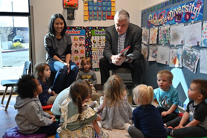 Gov. Steve Sisolak reads a story Thursday to children in Western Nevada College’s Child Development Center.