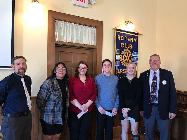 Patrick Mobley (coach, CHS speech and debate), Jacqueline Estrada Diaz, first place winner Jessica Knutson, Parker Schmid, second place winner Olivia VanReese, Rotary Club of Carson City President Rich Perry.