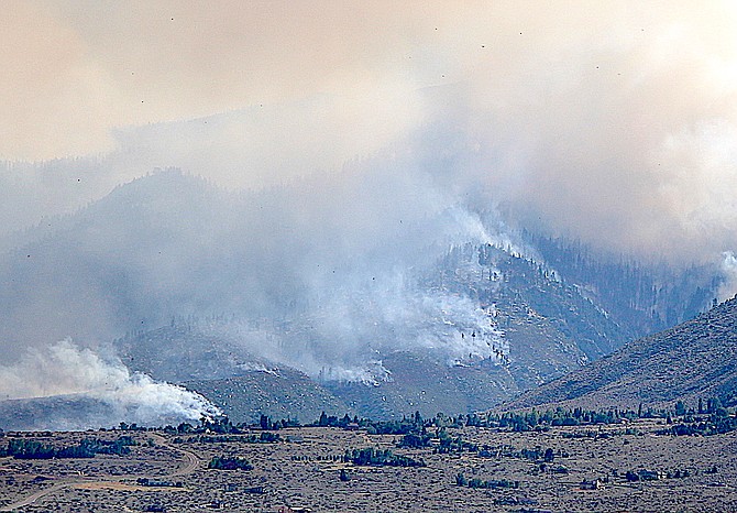 The Tamarack Fire burns on the mountain side above Woodfords on July 21, 2021.