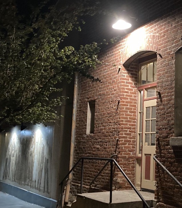 Mikey Wiencek, director of operations at the Brewery Arts Center, is especially pleased with how the new outdoor lighting frames the building without blinding pedestrians and cars.