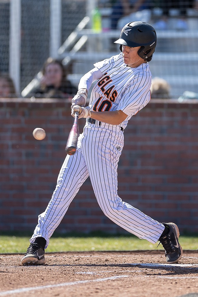 Douglas High’s Gavin Davis (No. 10) turns on a pitch against Dayton High Tuesday afternoon. Davis was 1-for-3 with an RBI in the Tigers’ 12-0 win over the Dust Devils.