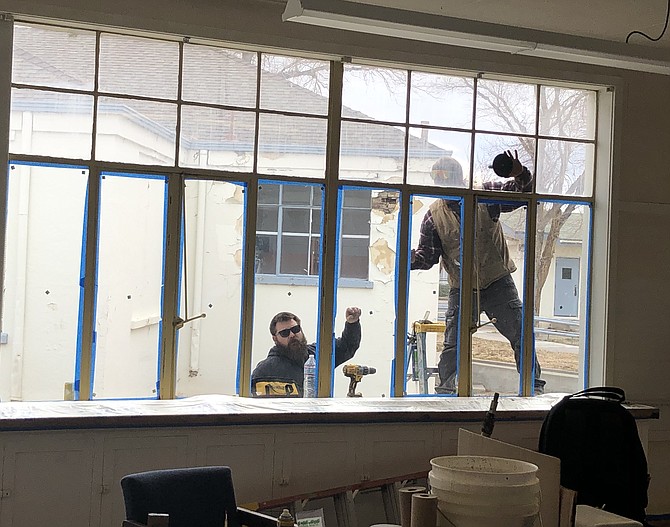 Windows are replaced as part of the Cottage School refurbishing effort this winter.