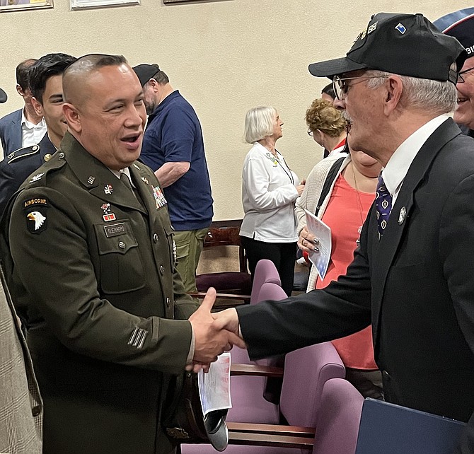 Army Col. Jerome Guerrero, left, director of personnel for the Nevada Army National Guard, meets Vietnam War veteran 1st. Lt. Andy LePeilbet the annual Vietnam Veterans Remembrance Day Ceremony.