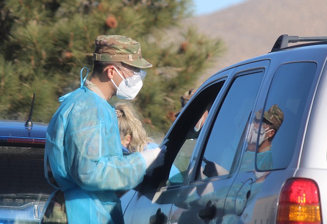 A National Guardsman conducts helps conduct community coronavirus testing at East Fork Station 12 in Sunridge on Dec. 8, 2020. Official said 440 people were tested during the event.