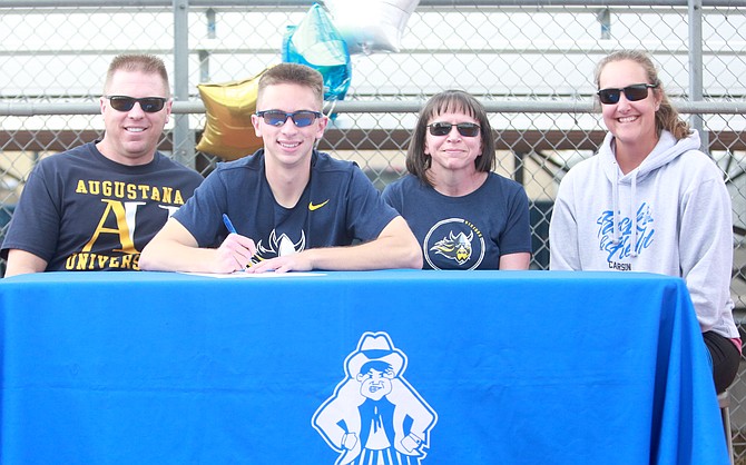 Carson High senior mid-distance runner Nicholas Batien signs his National Letter of Intent to continue his track career at Augustana University in Sioux Falls, South Dakota.