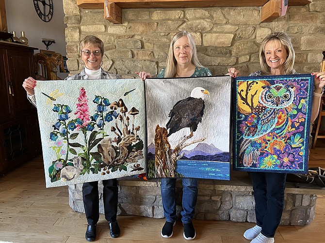 Quilt Guild winners Nancy Lampson, Laurie Lile and Terrie Peets. Lile’s ‘Eagle’s Overlook’ was voted first place by Guild members in February. Special to The R-C