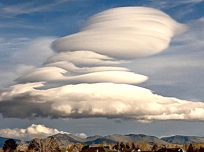 Stacked lenticular clouds cross the sky over Carson Valley on Monday evening. Photo by Dennis York