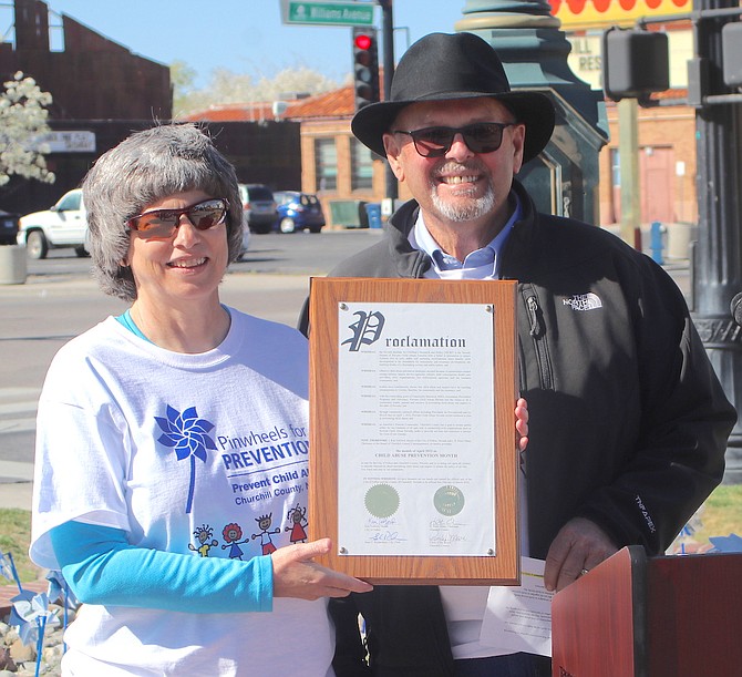 Steve Ranson / LVN
City of Fallon councilwoman Kelly Frost, left, and Churchill County Commission Chairman Pete Olsen present a proclamation declaring April as Child Abuse Prevention Month.