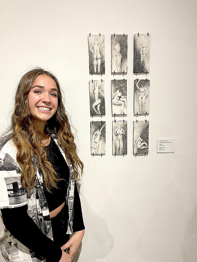 Senior Carissa Bilderback with her work “Insecurities/Expectations” which will go on display at Carnegie Hall in June.