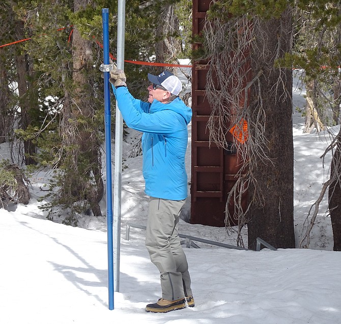Jeff Anderson, a hydrologist with the Natural Resource Conservation Service, takes the April SNOTEL (Snow Telemetry) site reading at Mount Rose Summit.