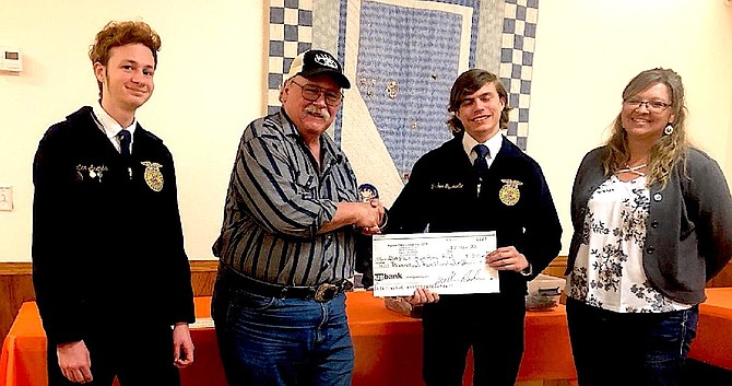 Gary Butori, second from left, of the Fallon Elks Club presents a check to Josh Gusewelle for the Oasis FFA program. From left are Hunter Arends, Butori, Gusewelle, and adviser Jackie Bogdanowicz.