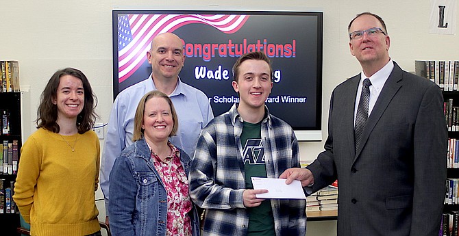 The Cushing family gathers with Wade, a senior at Churchill County High School, who has been awarded a $100,000 scholarship to a top-30 engineering university. From left are Rhiannon, Jason, Verity and Wade Cushing, along with Thomas Toland, director of engineering for Gemini.