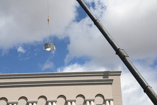 The crane near the Legislature Building will be out Friday lifting HVAC components to the roof. Workers will be installing the parts for several days following.