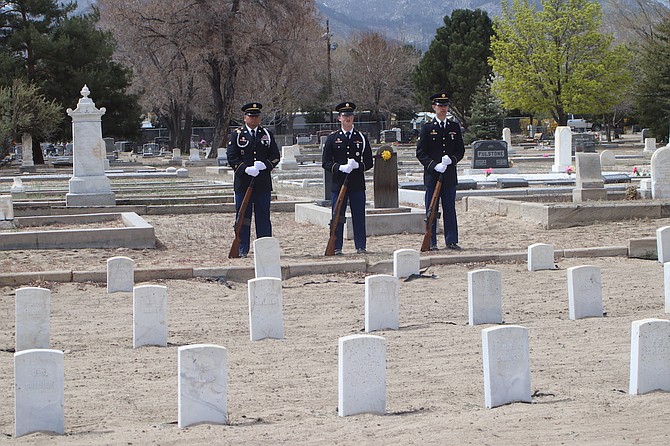 Nevada Army National Guard honor guard soldiers Spec 4 Jose Ramirez, left, Spec 4 Reid Howland, center, and Sgt. Chris Brezuela, stand behind the Civil War soldiers’ headstones at Lone Mountain Cemetery. The soldiers had served at Fort Churchill in the 1860s.