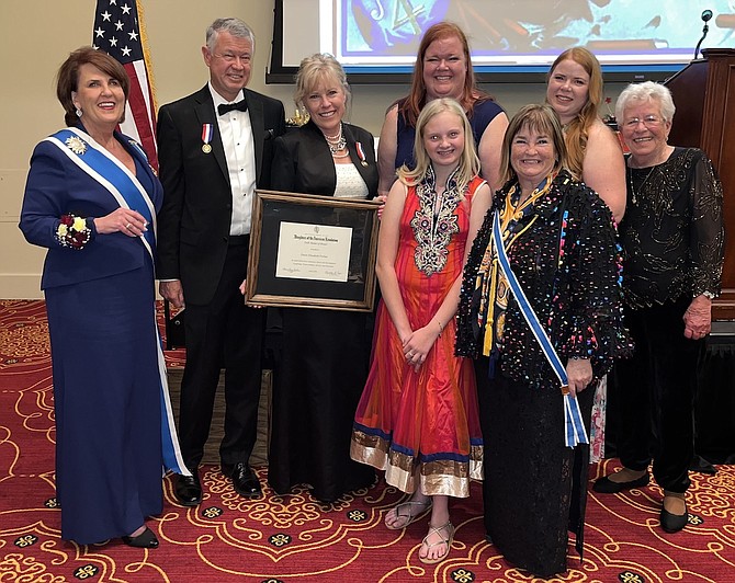 Jim and Dawn Forbus received on April 9 the Daughters of the American Revolution highest award, the Medal of Honor. Back row from left are Denise Doring VanBuren, the 45th president general of the National Society of the Daughters of the American Revolution; Jim and Dawn Forbus; daughters Lauren Tucker and Melissa Shore; and Dawn’s mother, Nancy Simerly. Front row are granddaughter Audrey Tucker, left, and Lori Bagwell, Carson City mayor and the state regent for Nevada and a member of the Battle Born Chapter.