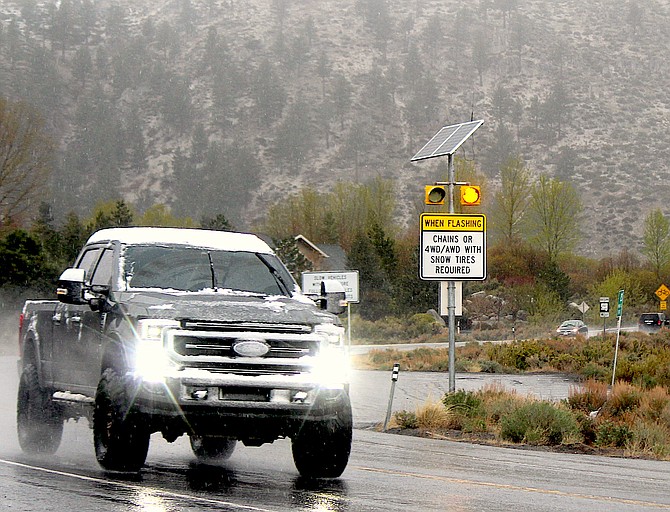 A pickup brings a little snow to Carson Valley after coming down Kingsbury on Thursday morning.
