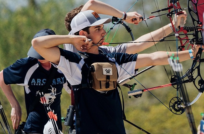 Cooper Davies draws back his compound bow during a competition. Davies will continue to compete in the compound bow division at University of the Cumberlands next year.