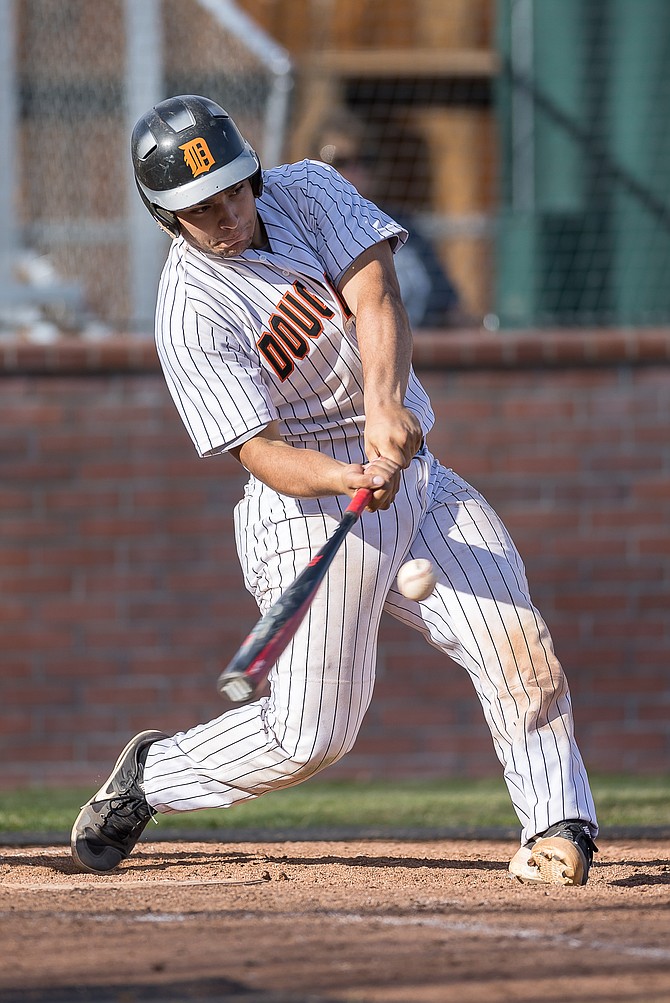 Douglas High’s Gabe Foster turns on a pitch earlier this season. With some changes in his approach at the plate, Foster has seen his batting average jump nearly 200 points this season.